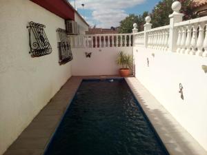 a swimming pool in the courtyard of a house at 2 Bed-Sleeps 5-Private Pool-Pets-AirCon in Mazarrón