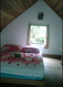 
Cama ou camas em um quarto em Chale Das Flores
