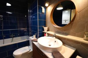 a bathroom with a sink and a toilet and a mirror at Room Emma,between bus and train station,Netflix,speed Wi-Fi in Zagreb