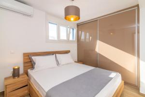 Postel nebo postele na pokoji v ubytování Villa Anemona Tinos + 33 fotografií
