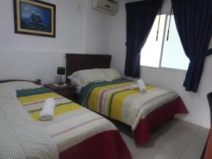 Ліжко або ліжка в номері Hotel Valeritos