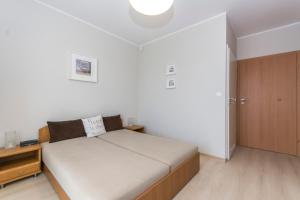 Postel nebo postele na pokoji v ubytování Willa Rodos II