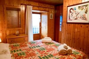 Posteľ alebo postele v izbe v ubytovaní TRE CIME FOCOBON - Bellavista sulle Dolomiti