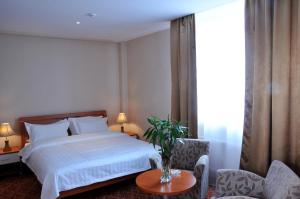 Postel nebo postele na pokoji v ubytování Springs Hotel Ulaanbaatar