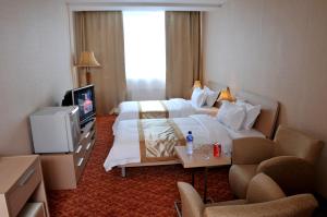 Postel nebo postele na pokoji v ubytování Springs Hotel Ulaanbaatar