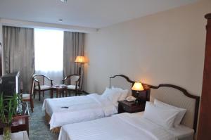 Postel nebo postele na pokoji v ubytování Springs Hotel Ulaanbaatar