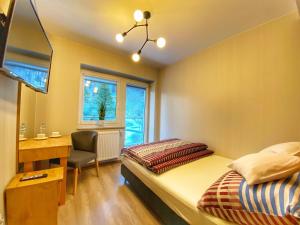 Postel nebo postele na pokoji v ubytování Kurort Kozubnik Apartament 33 Wellness &SPA