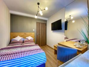 Łóżko lub łóżka w pokoju w obiekcie Kurort Kozubnik Apartament 33 Wellness &SPA