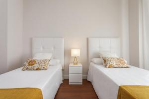 Posteľ alebo postele v izbe v ubytovaní Exclusive Apartments Street Beatas