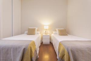Posteľ alebo postele v izbe v ubytovaní Exclusive Apartments Street Beatas