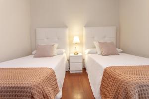 Posteľ alebo postele v izbe v ubytovaní Exclusive Apartments Street Beatas