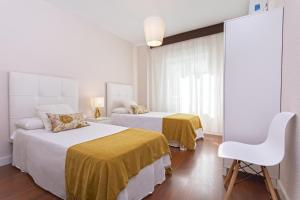 Posteľ alebo postele v izbe v ubytovaní Exclusive Apartments Street Beatas