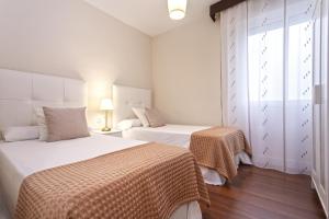 Posteľ alebo postele v izbe v ubytovaní Exclusive Apartments Street Beatas