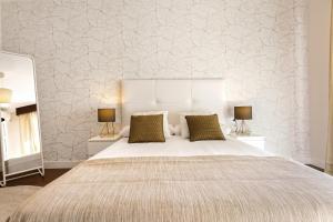 Posteľ alebo postele v izbe v ubytovaní Exclusive Apartments Street Beatas
