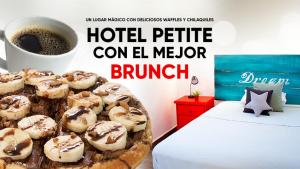 a tray of donuts on a bed next to a cup of coffee at La Casa del Barrio in Monterrey