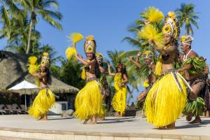 a large group of people dressed up in costumes at InterContinental Tahiti Resort & Spa, an IHG Hotel in Faaa