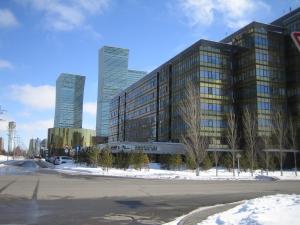 a large building with tall buildings in a city at Mini Hotel Alikhan in Astana