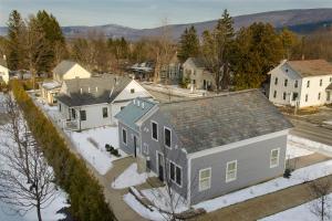 an aerial view of a house in a town at Kimpton Taconic Hotel by IHG in Manchester