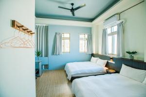 Postelja oz. postelje v sobi nastanitve Fun Trip - Fu May Sea View Holiday house l 無敵海景交誼廳 l 附汽機車租賃 l