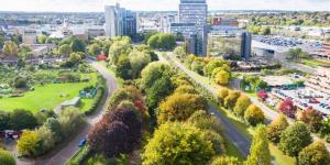 an aerial view of a city with trees and buildings at Basingstoke Spectacular 1 Bedroom Apartment in Basingstoke