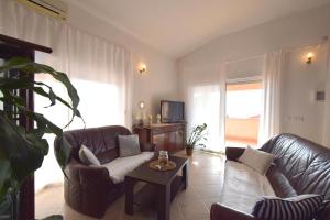 Televízia a/alebo spoločenská miestnosť v ubytovaní Apartment Luis