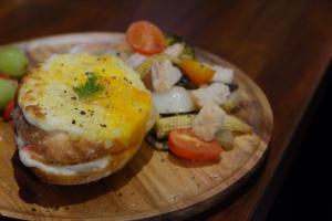 a plate of food with an egg sandwich and vegetables at CoffeeLoft in Taitung City
