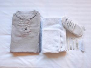 a pair of shorts and a sweater and a towel at Hotel Pacific Kanazawa in Kanazawa