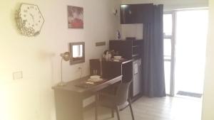 a room with a desk and a table and a window at VillaVin at 25 Vigne in Port Elizabeth