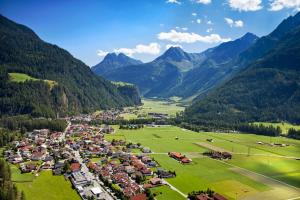 an aerial view of a village in the mountains at Appart Holzknecht in Längenfeld