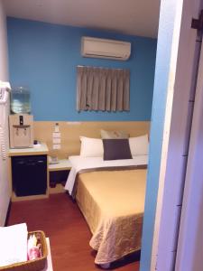 Voodi või voodid majutusasutuse Yung Feng Hotel toas