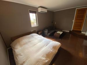 Letto o letti in una camera di Auberge Mermaid