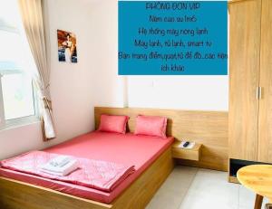 Postel nebo postele na pokoji v ubytování Nhà Nghỉ LÂM ANH