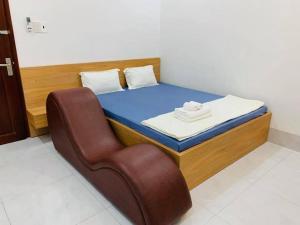 Postel nebo postele na pokoji v ubytování Nhà Nghỉ LÂM ANH