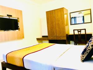 Krevet ili kreveti u jedinici u objektu Hotel Half Moon Chennai
