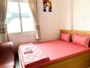 Postel nebo postele na pokoji v ubytování Nhà Nghỉ LÂM ANH