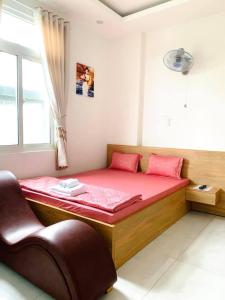 Postel nebo postele na pokoji v ubytování Nhà Nghỉ LÂM ANH