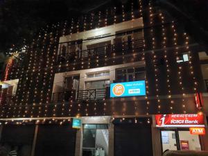 a building with christmas lights on the side of it at Hotel Victoria in Chandīgarh +6 photos