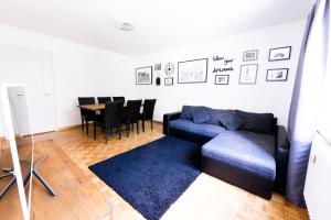 a living room with a couch and a table at Armotti Apartments Friedheim in Bern
