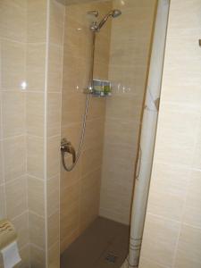 a shower in a bathroom with a glass door at Kazanok in Svitlogirske