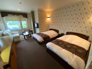 Letto o letti in una camera di Auberge Mermaid