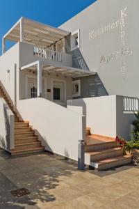a house with a staircase in front of it at Kalimera Karpathos Exclusive Villas in Afiartis