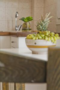 a bowl of fruit on a counter in a kitchen at Kalimera Karpathos Exclusive Villas in Afiartis
