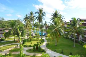 an aerial view of a resort with palm trees at Maehaad Bay Resort - SHA Plus in Mae Haad