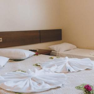 Łóżko lub łóżka w pokoju w obiekcie Hotel Sol Bahia