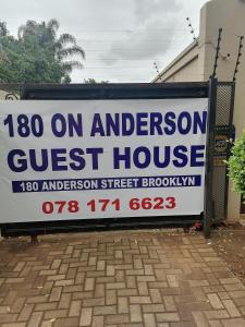 een bord voor een pension voor een huis bij 180 On Anderson Guest House in Pretoria
