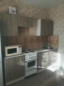A cozinha ou cozinha compacta de Apartment Аэропорт Иркутска