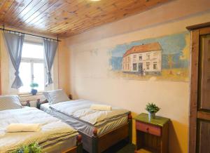 Postel nebo postele na pokoji v ubytování Hotel Plesivec