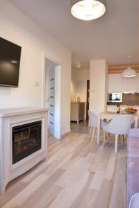Kuchyňa alebo kuchynka v ubytovaní Apartamenty KORAL