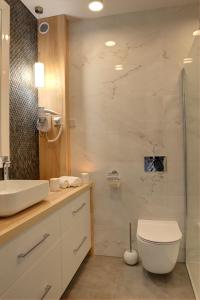 Kúpeľňa v ubytovaní Apartamenty KORAL