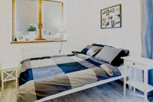 Postel nebo postele na pokoji v ubytování GRAPA LOFT Dom w Górach Apartament Wypoczynek w górach